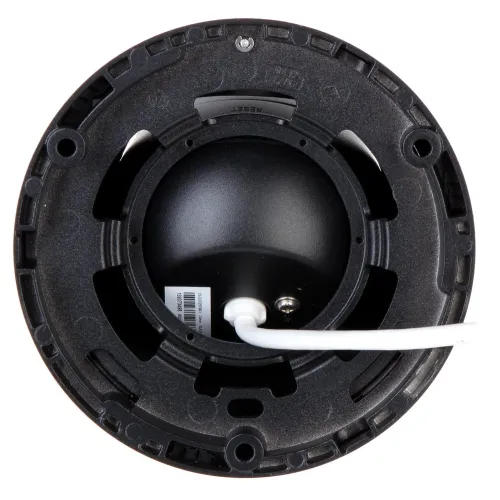 The image shows the underside of a black, circular mounting bracket designed for a security camera, featuring a central cavity and a white cable extending from it. The bracket has multiple screw holes for secure attachment and a textured surface for durability.