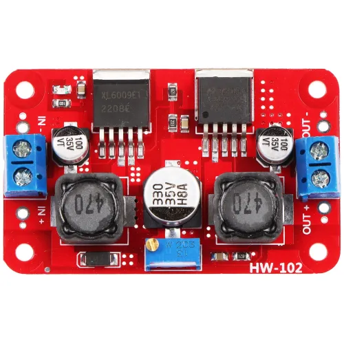 The image shows a red DC-DC step-down voltage regulator module with multiple electronic components, including capacitors, inductors, and connectors. It features input and output terminals on either side for easy integration into electronic projects.