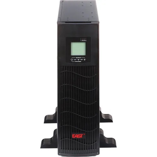 Front view of a black uninterruptible power supply (UPS) with a digital display and ventilation grille. The unit is designed for vertical placement and features stabilizing side supports.