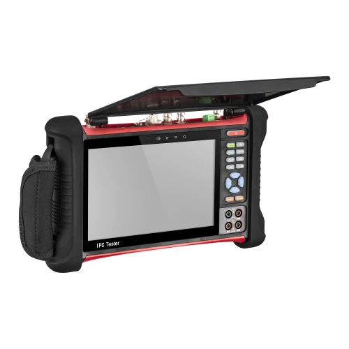 The image shows a multifunctional CCTV tester with a large screen and various control buttons, designed for professional security system installations. It features a sturdy, portable design with a protective cover and a side strap for easy handling.