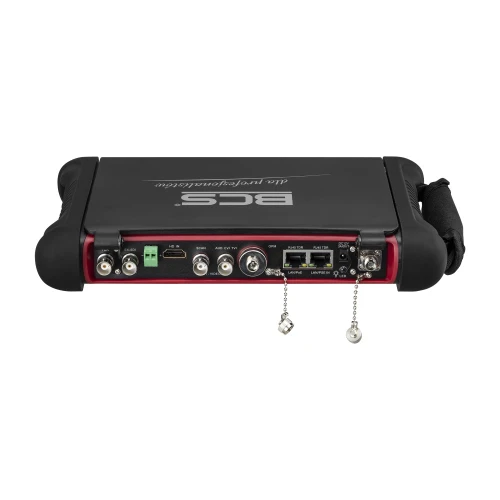 The image shows a multifunctional CCTV tester with various input and output ports, including HDMI, Ethernet, and BNC connections. The device features a durable design with protective rubber edges and a carrying strap for easy handling.