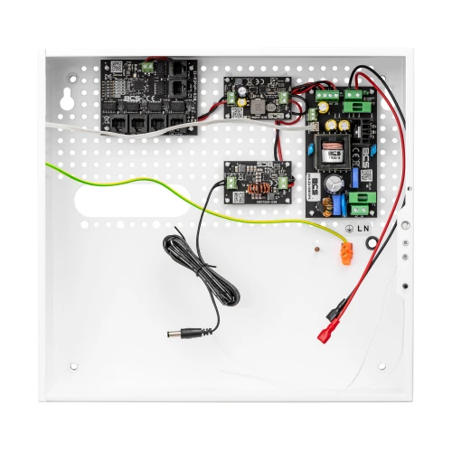 The image shows a white perforated metal enclosure containing a buffer power supply unit for cameras, featuring various electronic components and wiring. The setup includes circuit boards, connectors, and a power cable, designed for efficient power management and distribution.