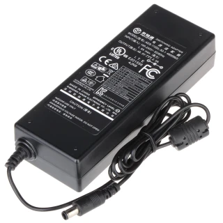 The image shows a black rectangular switching adapter with various certification labels and specifications printed on its surface. It features a connected power cord with a cylindrical connector at the end.