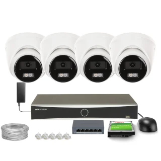 The image shows a Hikvision surveillance system, including four dome cameras, a network video recorder, and various accessories such as cables and connectors. The setup is designed for comprehensive security monitoring, offering high-quality video capture and storage.