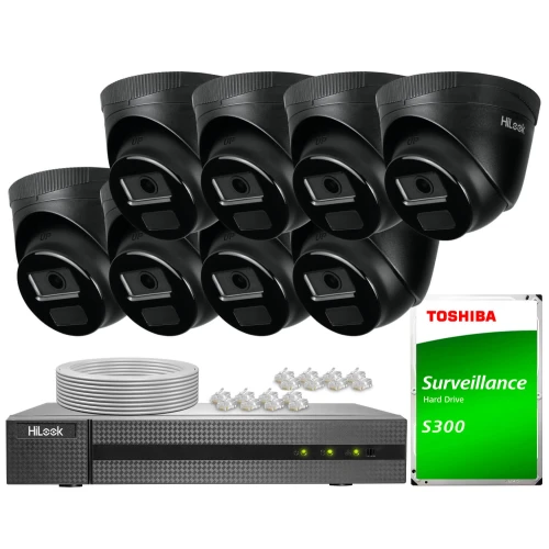 The image shows a complete surveillance system set, including six black dome cameras, a digital video recorder, and a Toshiba surveillance hard drive. Also included are cables and connectors necessary for installation.
