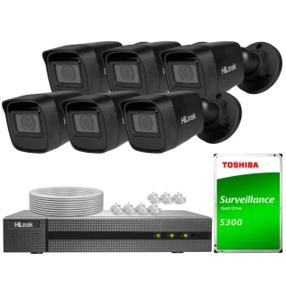 The image shows a complete surveillance system featuring six black HiLook security cameras, a digital video recorder, and a Toshiba S300 hard drive. Also included are cables and connectors for easy installation.