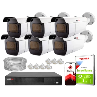 The image shows a comprehensive IP surveillance kit featuring six white security cameras, a digital video recorder, and a 1TB Toshiba surveillance hard drive. Also included are a bundle of cables, connectors, and a mobile app interface for remote monitoring.