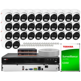 The image shows a comprehensive IP surveillance system featuring multiple dome cameras, network switches, and a central recording unit. Additionally, a Toshiba S300 surveillance hard drive is included, along with cables and connectors for installation.
