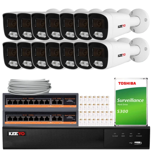 The image shows a comprehensive IP surveillance system featuring twelve white security cameras, a network video recorder, and a Toshiba surveillance hard drive. Included are two network switches, a bundle of Ethernet cables, and connectors for easy installation.