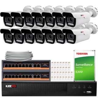 The image shows a comprehensive surveillance system package, including multiple white security cameras, a network video recorder, and a Toshiba surveillance hard drive. Also included are network cables and connectors, providing a complete setup for monitoring and recording.