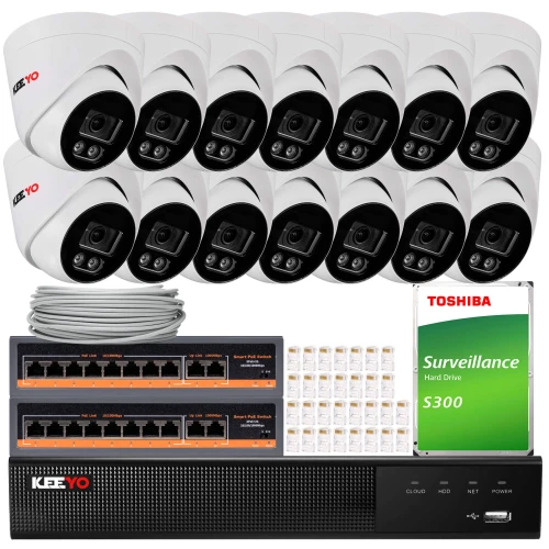 The image shows a comprehensive surveillance system package, including multiple dome cameras, a network video recorder, and a Toshiba surveillance hard drive. Also included are Ethernet cables and connectors, providing a complete setup for monitoring and security needs.