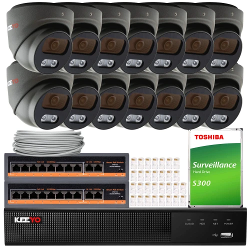 The image shows a comprehensive surveillance system package, including multiple dome cameras, a network video recorder, and a Toshiba surveillance hard drive. The set also features Ethernet cables and connectors, providing a complete solution for monitoring and security needs.