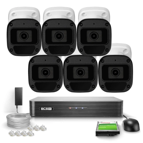 The image shows a complete surveillance system featuring six black and white security cameras, a central recording unit, and various accessories including cables and connectors. This setup is designed for comprehensive monitoring and security, suitable for both residential and commercial use.