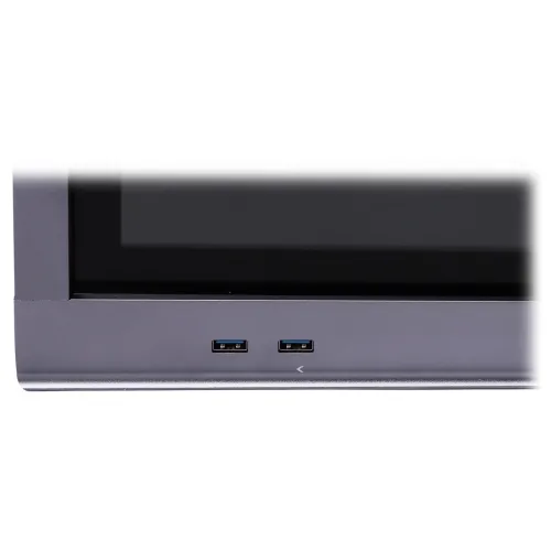 The image shows a close-up of a sleek, modern device featuring two USB ports on its front panel. The ports are symmetrically aligned, emphasizing the device's minimalist and functional design.