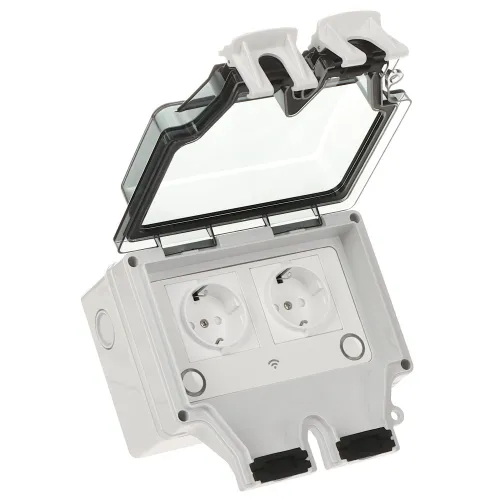 The image shows a weatherproof electrical outlet box with two European-style sockets, featuring a transparent protective cover. The box is designed for outdoor use, providing secure and safe access to power in various environments.