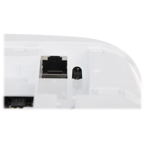 The image shows a close-up of a white electronic device featuring an Ethernet port and a power input socket. The sleek design highlights the connectivity options available on the device.